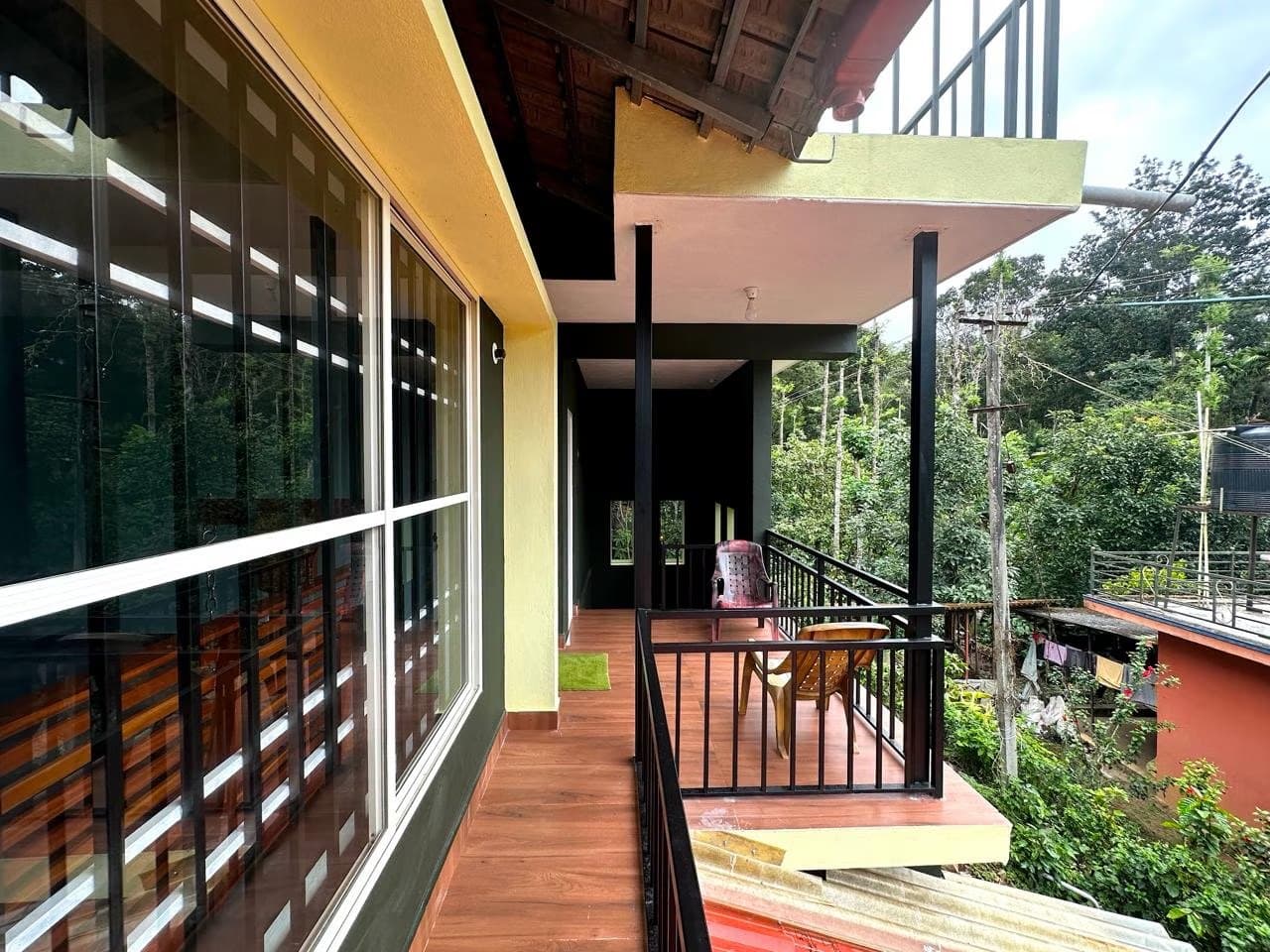 Balcony at Leaflink overlooking trees and plantation greenery