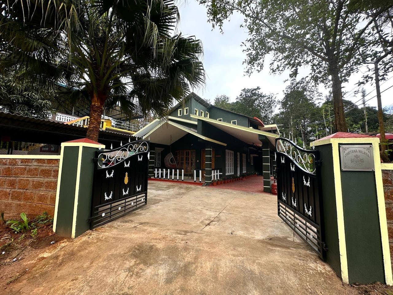 Open gate and driveway leading to Leaflink homestay